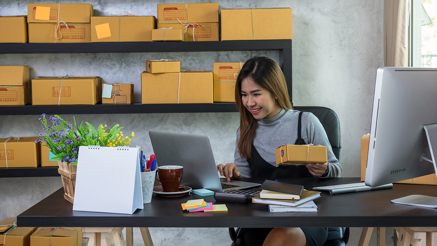 Young asian teenager owner business woman work at home for online shopping, checking order and prepaing package the product with office equipment, entrepreneur and alpha generation life style concept